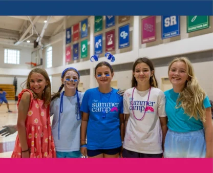 kids in a gym smiling with face paint on